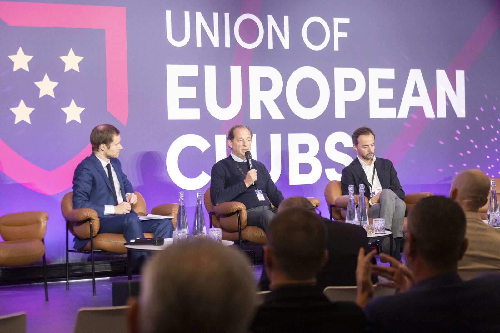 A panel on stage at a previous UEC Forum